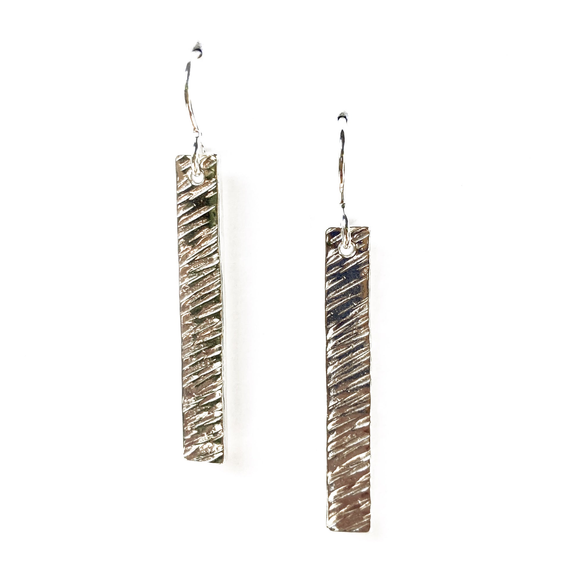 Two silver vertical rectangular earrings with angled line texture