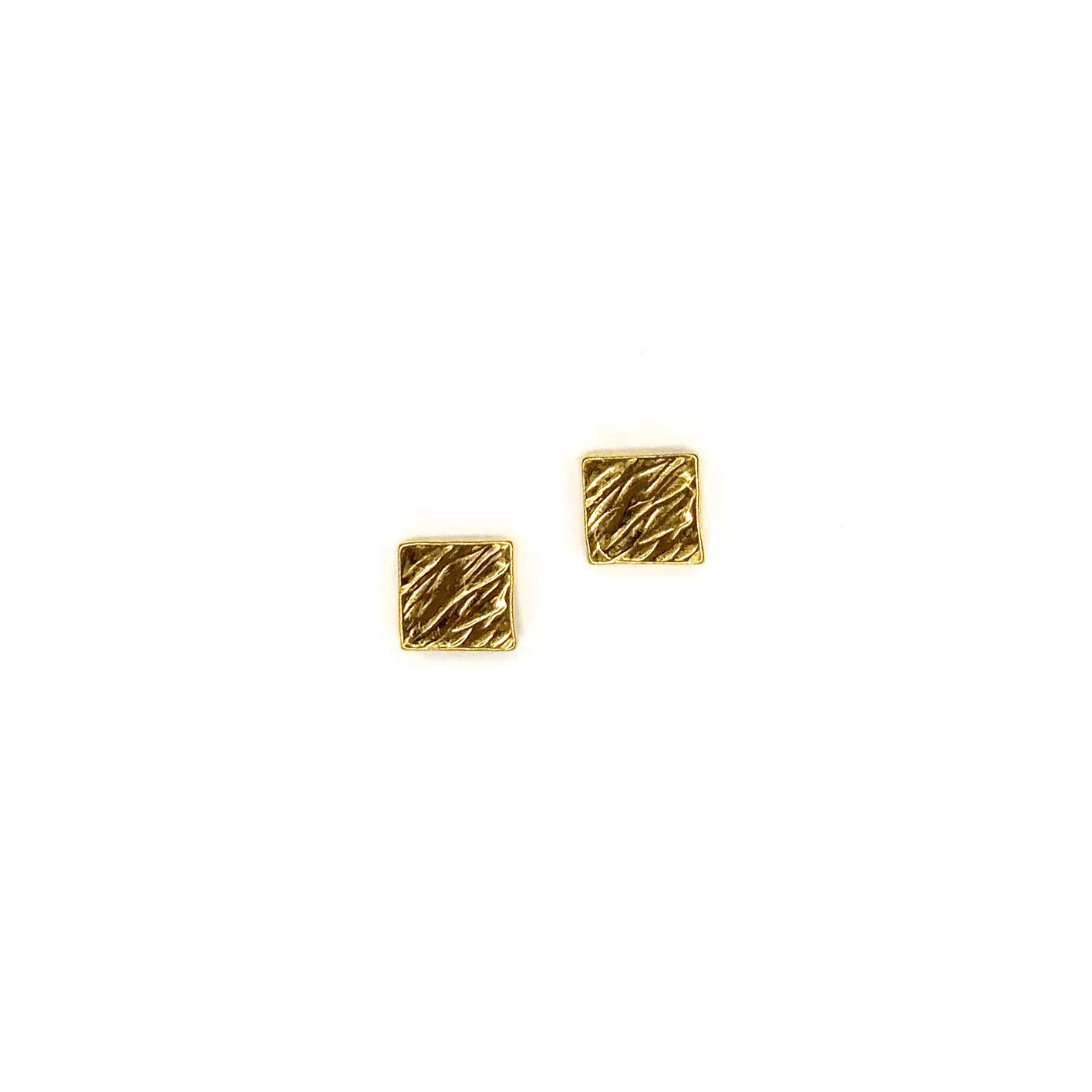 Pair of gold vermeil square studs with a hatched texture on a white background