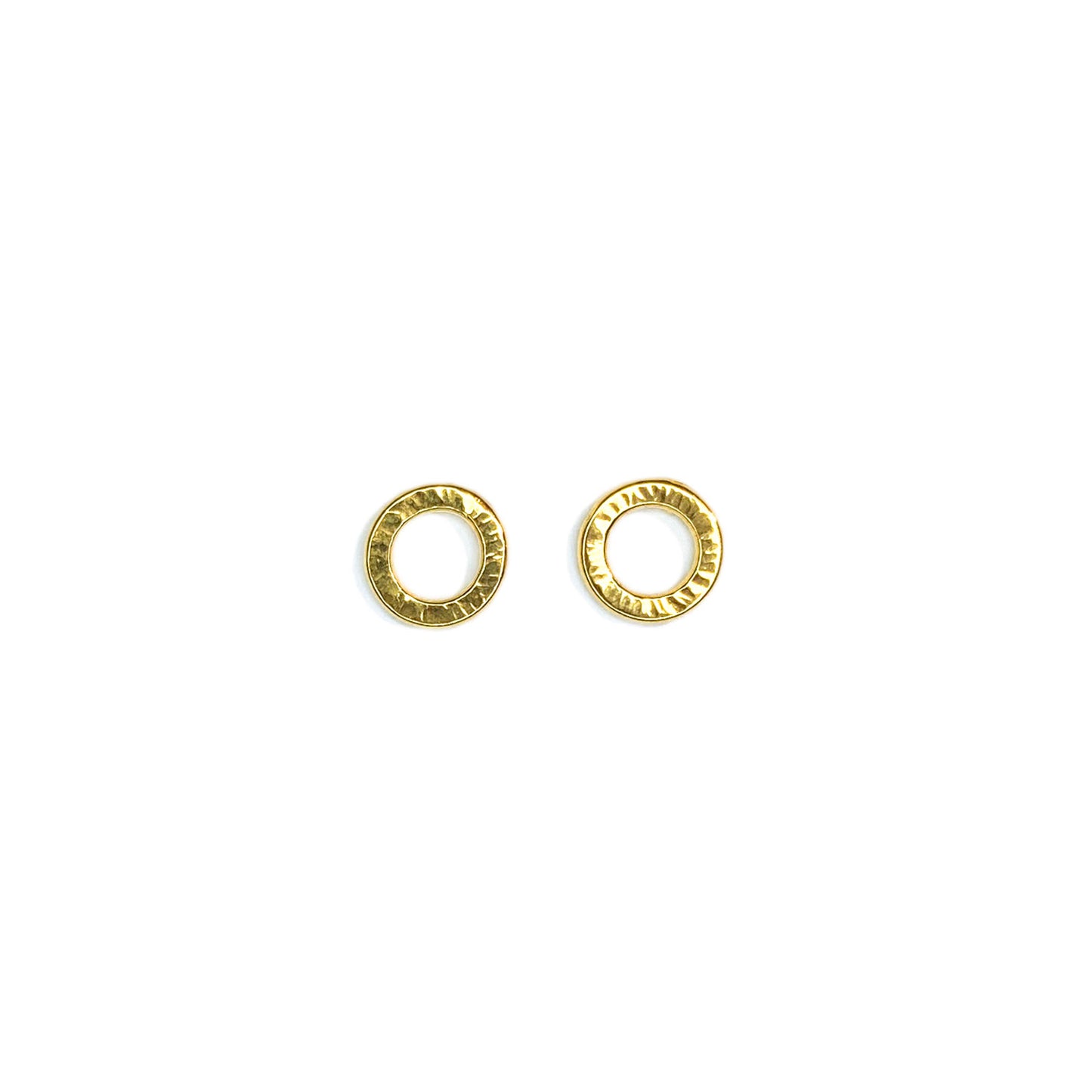 Open circle studs with texture radiating from the center on a white background