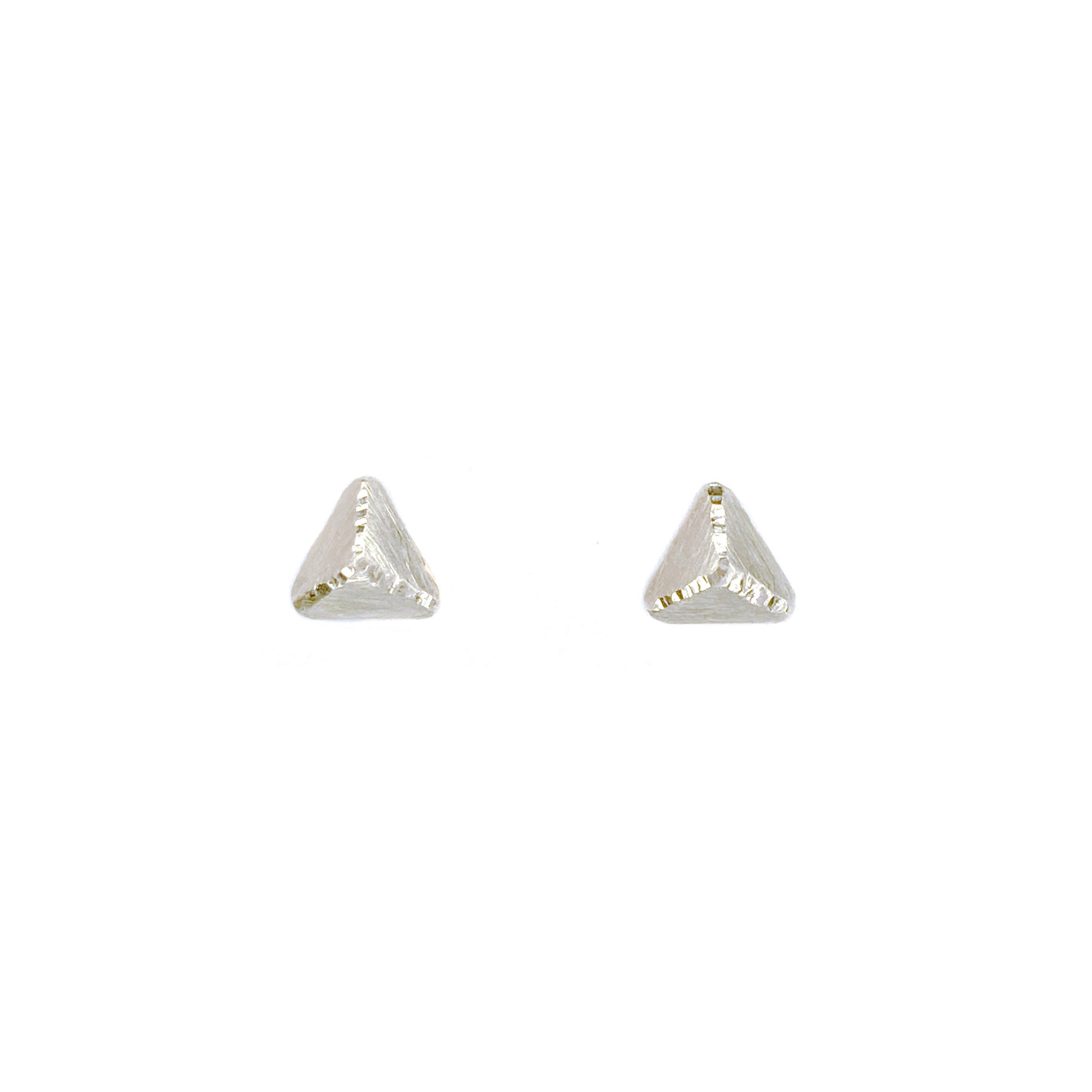 Tiny pyramid shaped stud earrings in silver